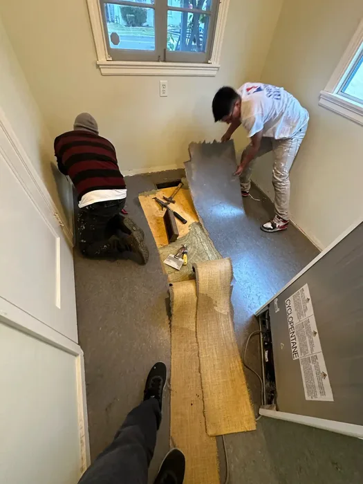 Detailed wallpaper installation work showing precision craftsmanship