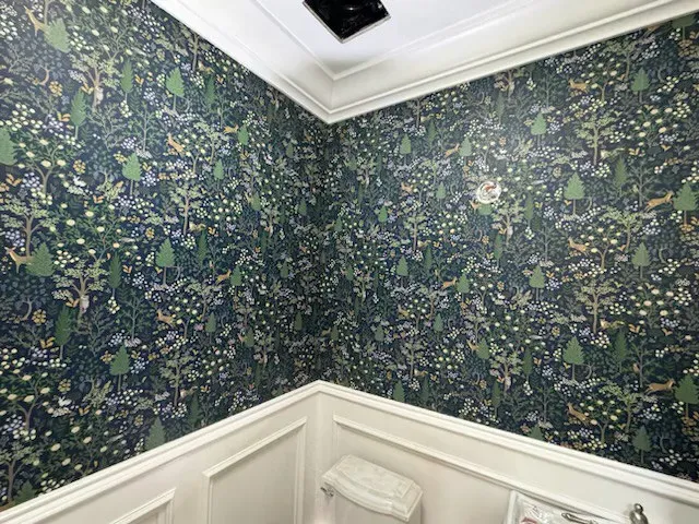 Modern geometric wallpaper installed in a residential bedroom