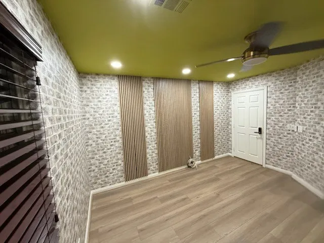 Luxury grasscloth wallpaper installed in a Warwick estate living room