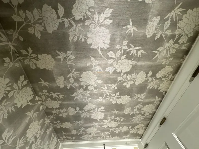 Residential wallpaper installation featuring a subtle stripe pattern