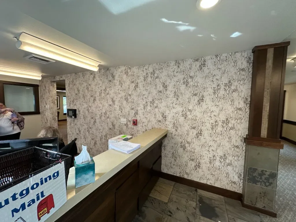 Commercial vinyl wall covering being installed in a Providence office lobby