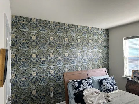 Historic home wallpaper restoration showing detailed plaster wall preparation