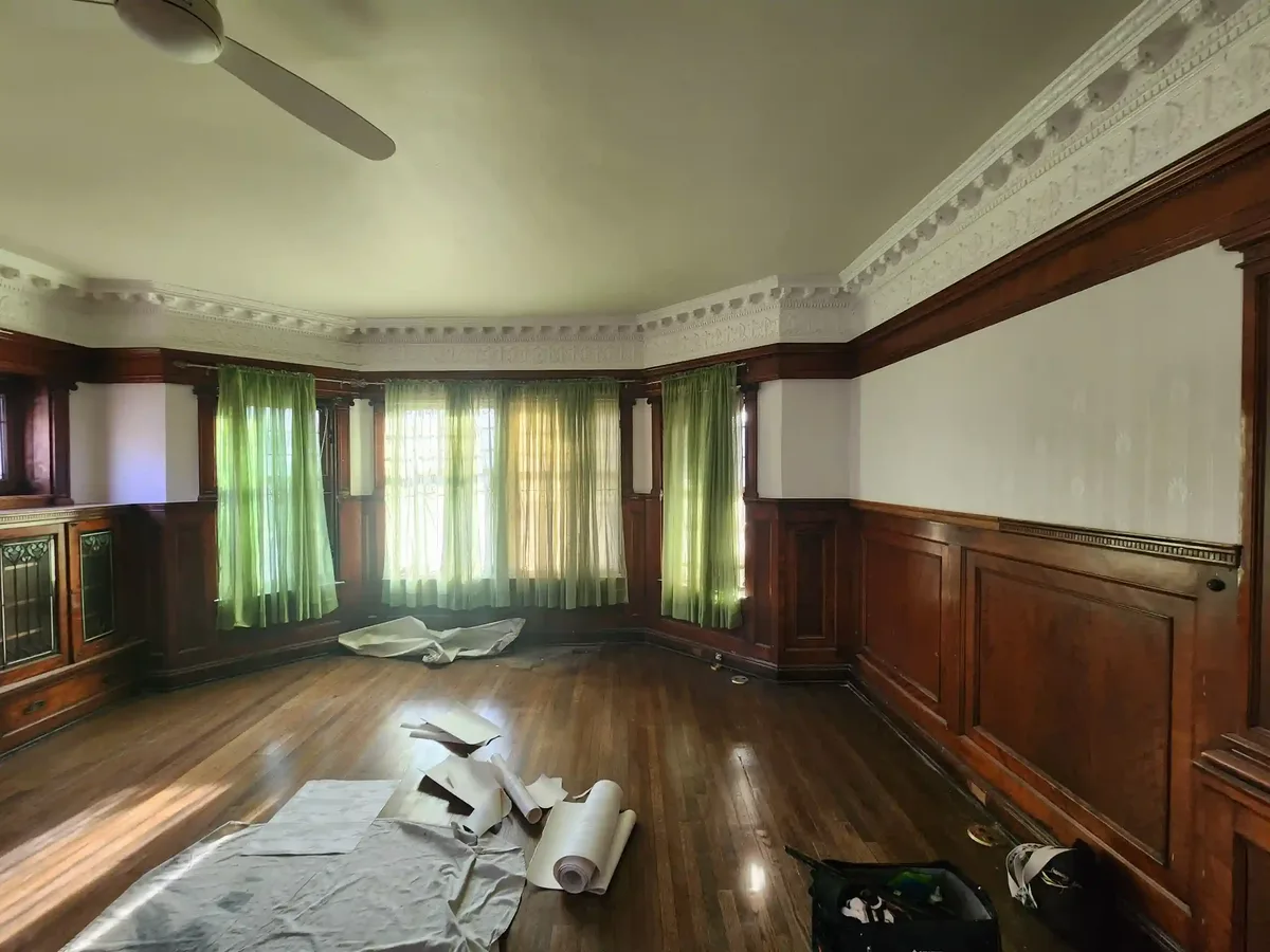 Historic home wallpaper restoration with period-appropriate materials