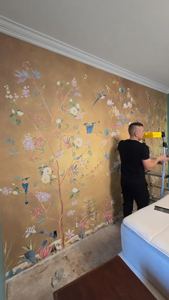 Residential wallcovering expert installing designer wallpaper
